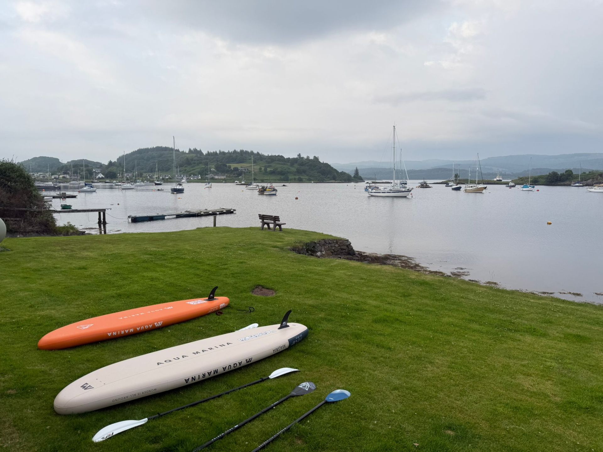 Paddleboards on the garden lawn overlooking Tayvallich Bay
